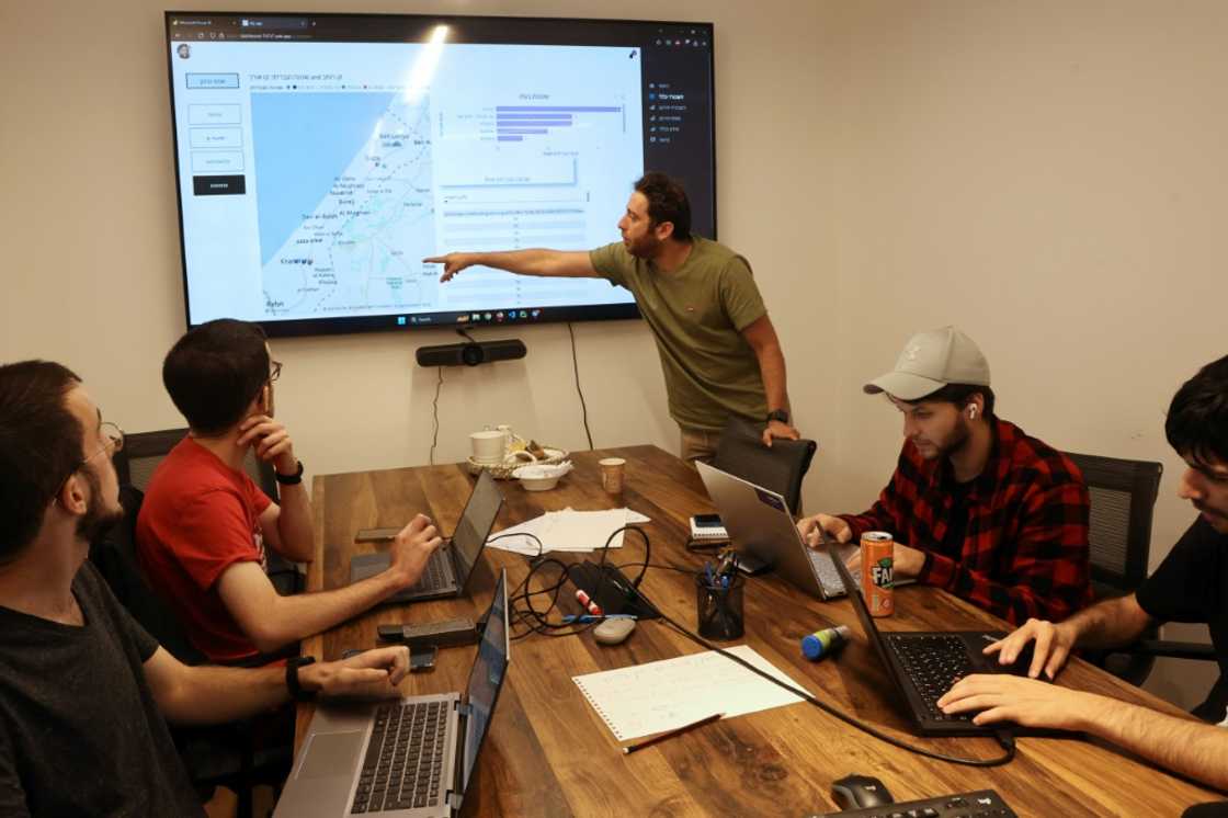Tech industry volunteers analyse data on missing hostages at an office in Tel Aviv Tech industry volunteers analyse data on missing hostages at an office in Tel Aviv