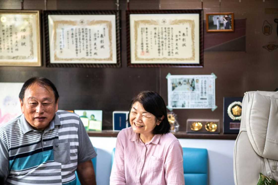 Yoshimitsu (L) and Midori Miyatsu, the adoptive parents of Koichi Miyatsu, have fostered more than 30 children Yoshimitsu (L) and Midori Miyatsu, the adoptive parents of Koichi Miyatsu, have fostered more than 30 children