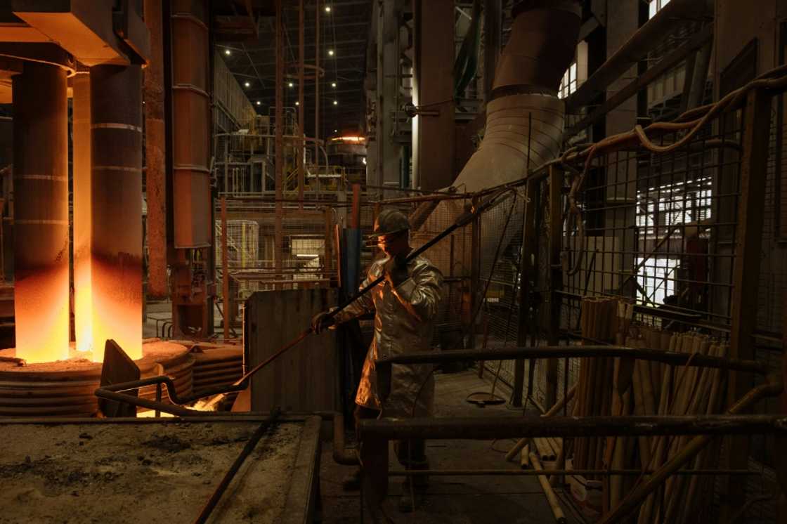 An employee wearing a protective gear works in a continuous steel casting department at the ArcelorMittal steel plant in Kryvyi Rig An employee wearing a protective gear works in a continuous steel casting department at the ArcelorMittal steel plant in Kryvyi Rig