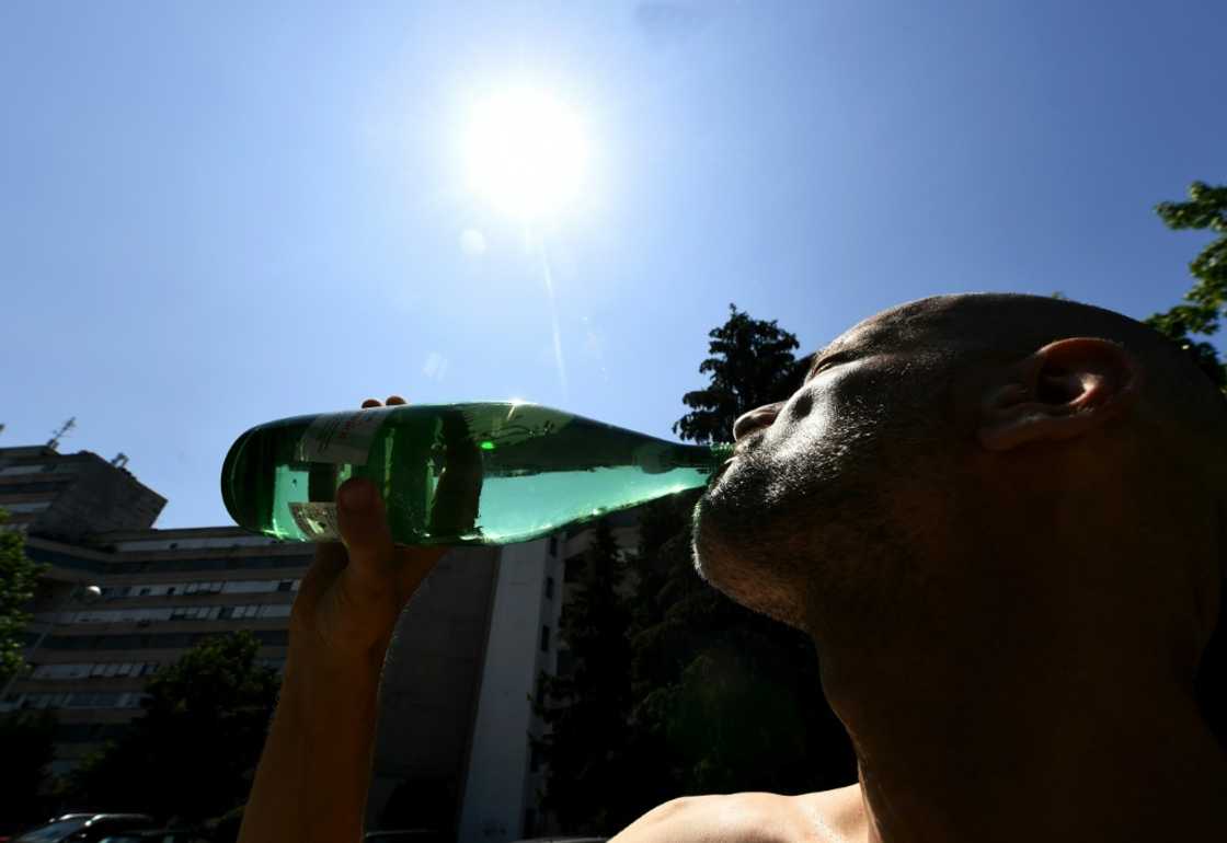 Sweltering: A man drinks as the Croatian capital Zagreb bakes during a heat wave Sweltering: A man drinks as the Croatian capital Zagreb bakes during a heat wave