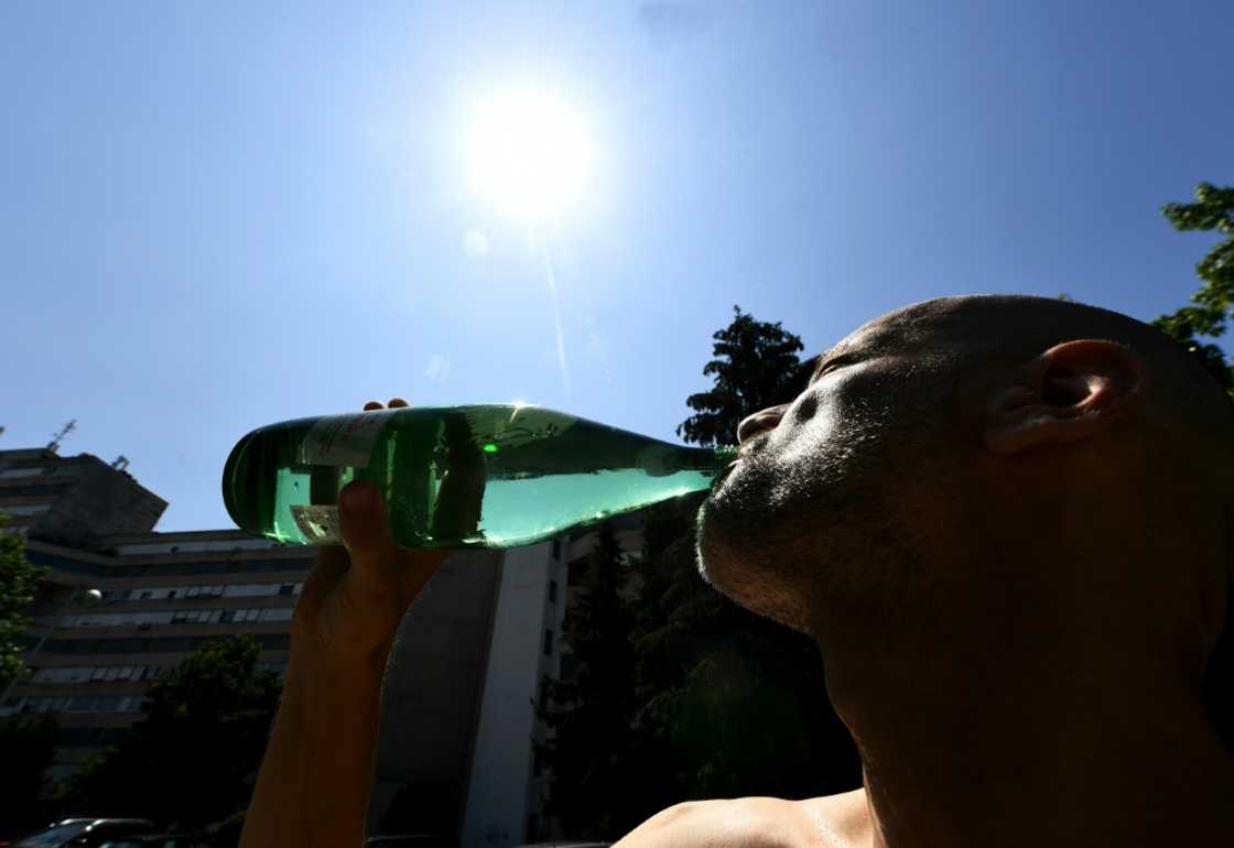 Jumping: A man drinks as Croatia's capital Zagreb bakes during a heatwave