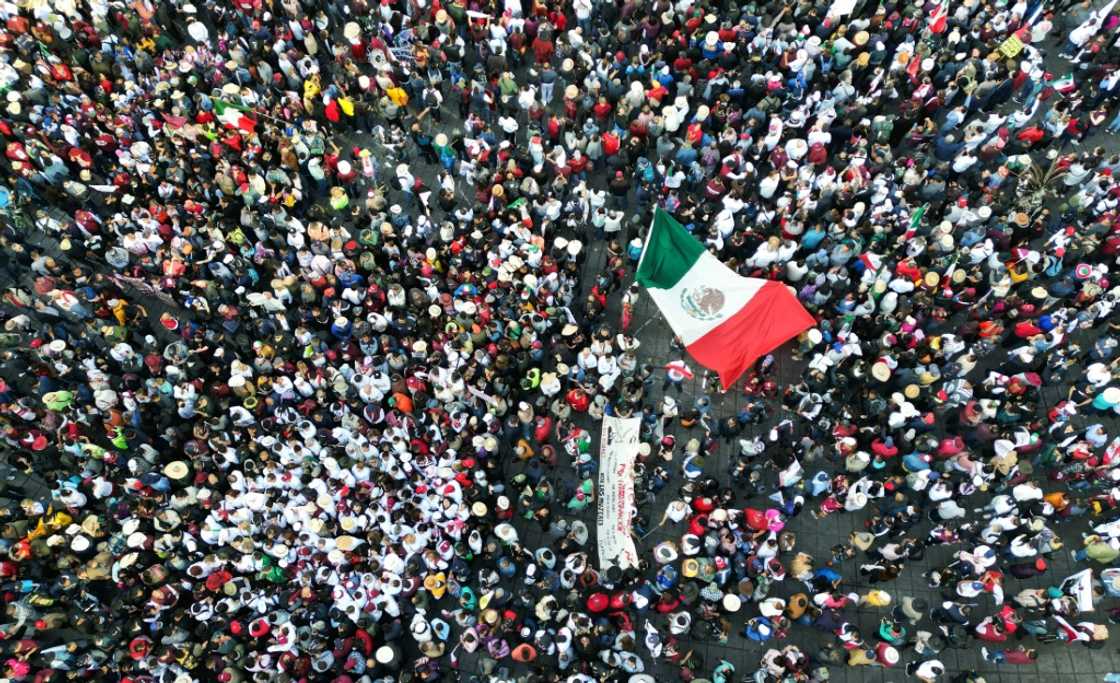 Mexico's president joined flag-waving crowds for a rally that comes as his allies warm up for the race to replace him in 2024 Mexico's president joined flag-waving crowds for a rally that comes as his allies warm up for the race to replace him in 2024
