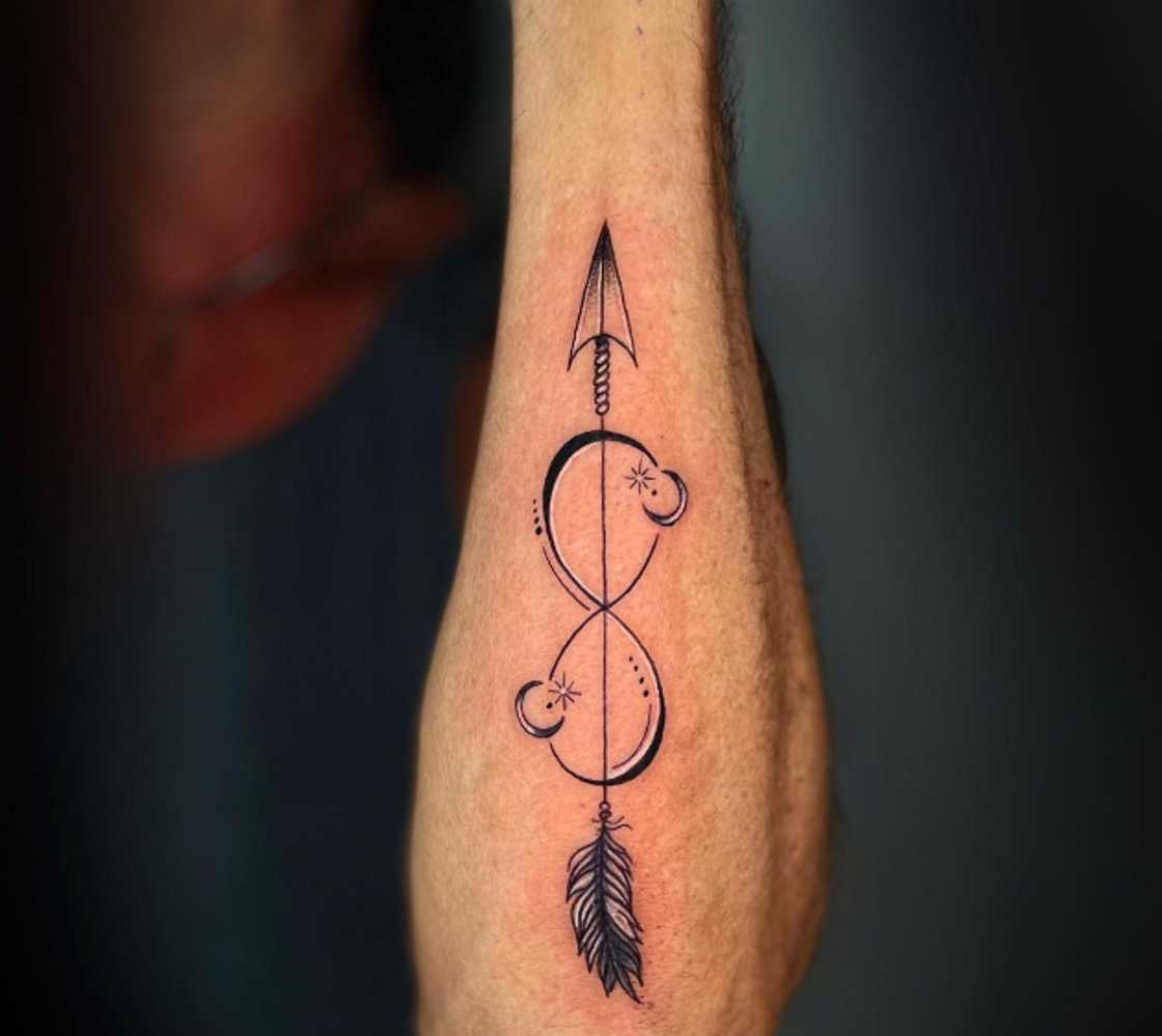 Long hand arrow tattoo