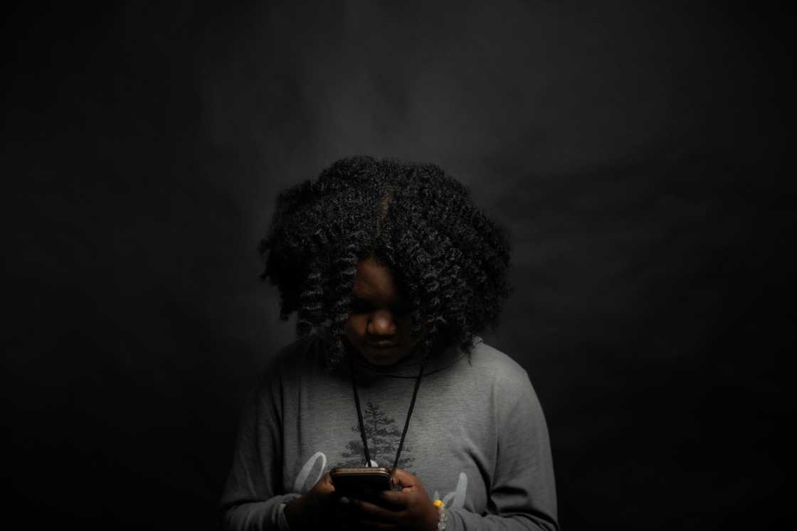 A woman scrolling a phone