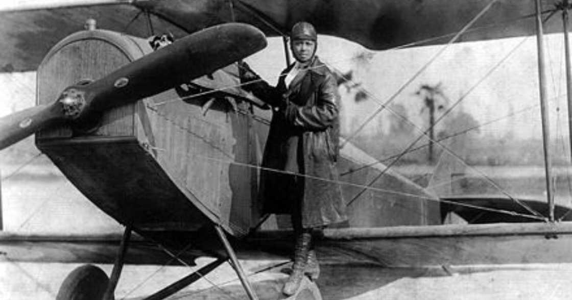 Bessie Coleman poses beside a plane Bessie Coleman poses beside a plane