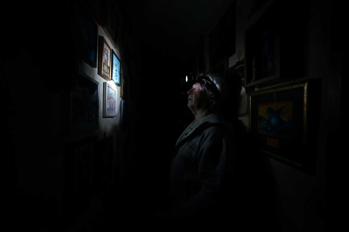 Igor Zhuk wears a headlamp during power cuts at his Kyiv home Igor Zhuk wears a headlamp during power cuts at his Kyiv home