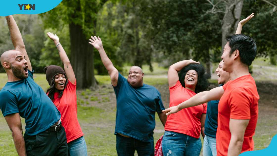 A group of friends lifting hands A group of friends lifting hands