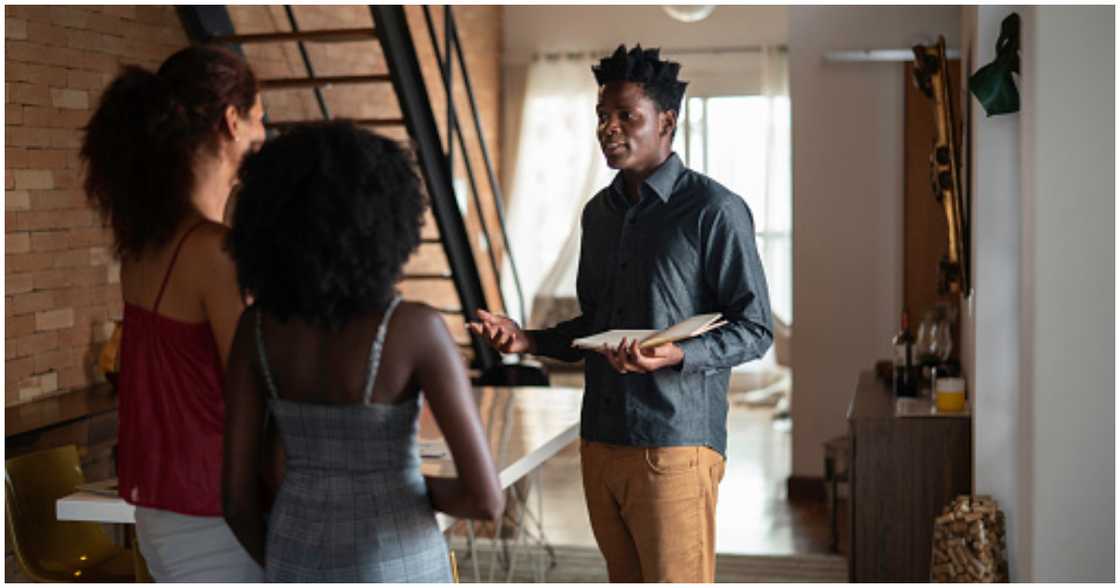 An agent sends two people for property viewing An agent sends two people for property viewing