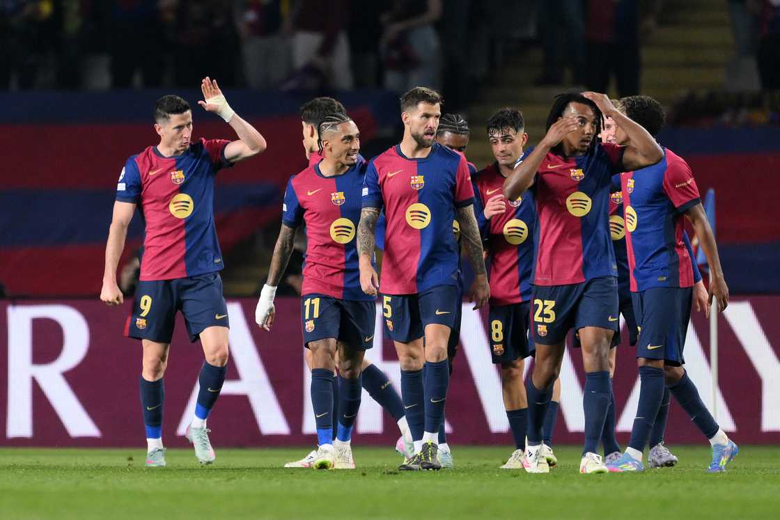 Robert Lewandowski and his Barcelona teammates celebrate his third goal against Borussia Dortmund in their UEFA Champions League quarter-final match on April 9, 2025 in Barcelona, Spain Robert Lewandowski and his Barcelona teammates celebrate his third goal against Borussia Dortmund in their UEFA Champions League quarter-final match on April 9, 2025 in Barcelona, Spain