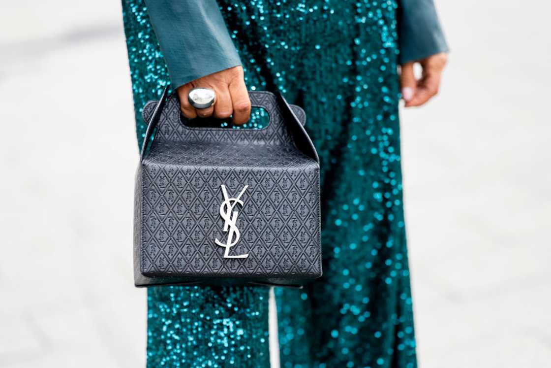 Influencer Gitta Banko posing with a black Saint Laurent bag. Influencer Gitta Banko posing with a black Saint Laurent bag.