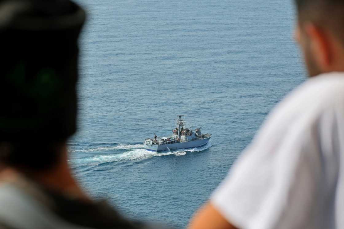 People watch as an Israeli navy fast patrol boat sails in the Mediterranean sea off Rosh HaNikra in northern Israel, close to the border area with Lebanon, ahead of the planned signing of the maritime accord People watch as an Israeli navy fast patrol boat sails in the Mediterranean sea off Rosh HaNikra in northern Israel, close to the border area with Lebanon, ahead of the planned signing of the maritime accord