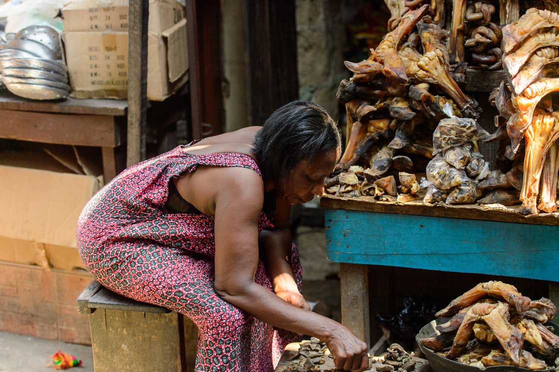 A woman is selling fish