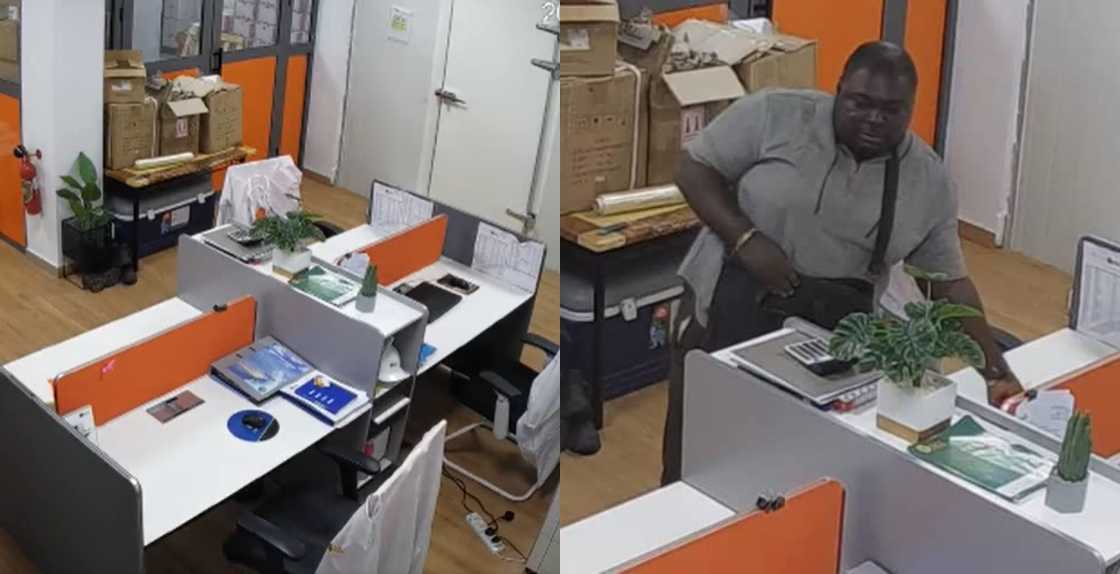 Man stealing laptops from the office Man stealing laptops from the office
