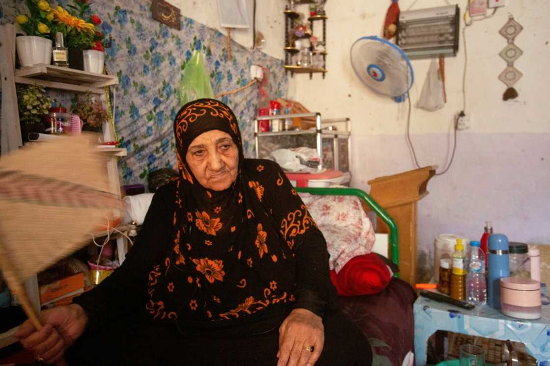 Um Mohammed sits inside her home in Iraq's southern city of Basra. Iraq, battered by decades of conflict that has sapped its infrastructure, is struggling with droughts, repeated sandstorms, desertification and a drop in river levels Um Mohammed sits inside her home in Iraq's southern city of Basra. Iraq, battered by decades of conflict that has sapped its infrastructure, is struggling with droughts, repeated sandstorms, desertification and a drop in river levels