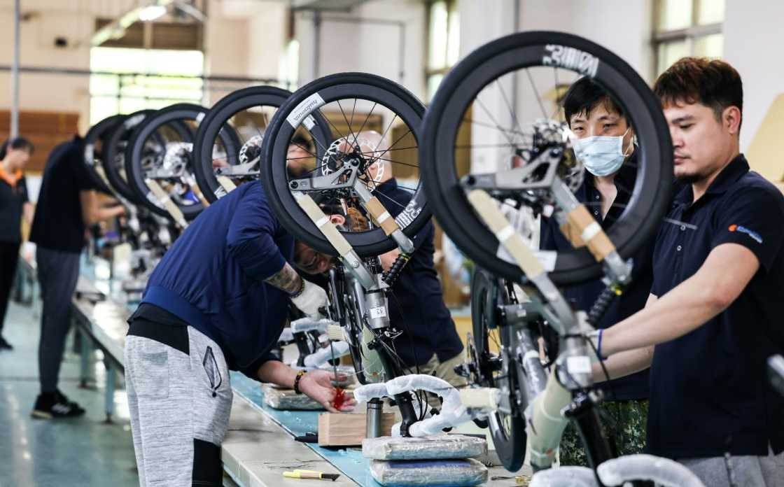 Workers assemble fold-up bicycles mostly destined for Europe and Asia at a factory of Pacific Cycles in Taoyuan on April 30, 2025 Workers assemble fold-up bicycles mostly destined for Europe and Asia at a factory of Pacific Cycles in Taoyuan on April 30, 2025
