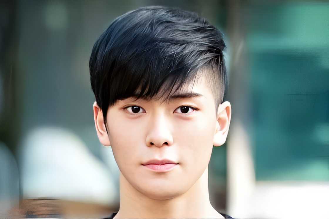 An Asian man is wearing a fringe haircut