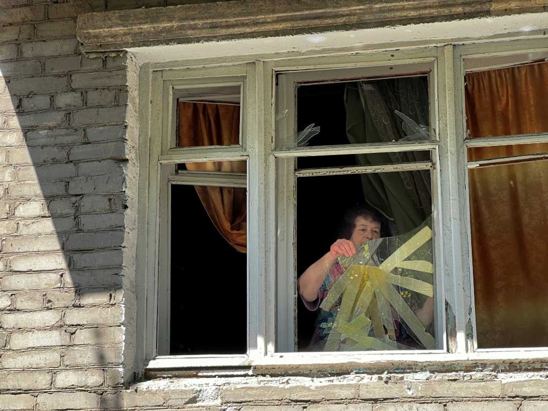 "There's nowhere to hide," says pensioner Tatiana Levchenko, as she removes broken glass from her home in Sloviansk, damaged by Russian shelling "There's nowhere to hide," says pensioner Tatiana Levchenko, as she removes broken glass from her home in Sloviansk, damaged by Russian shelling
