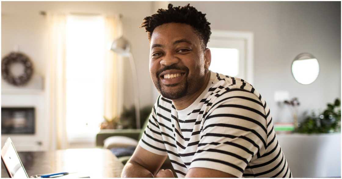 Photo of man smiling in a beautiful house Photo of man smiling in a beautiful house