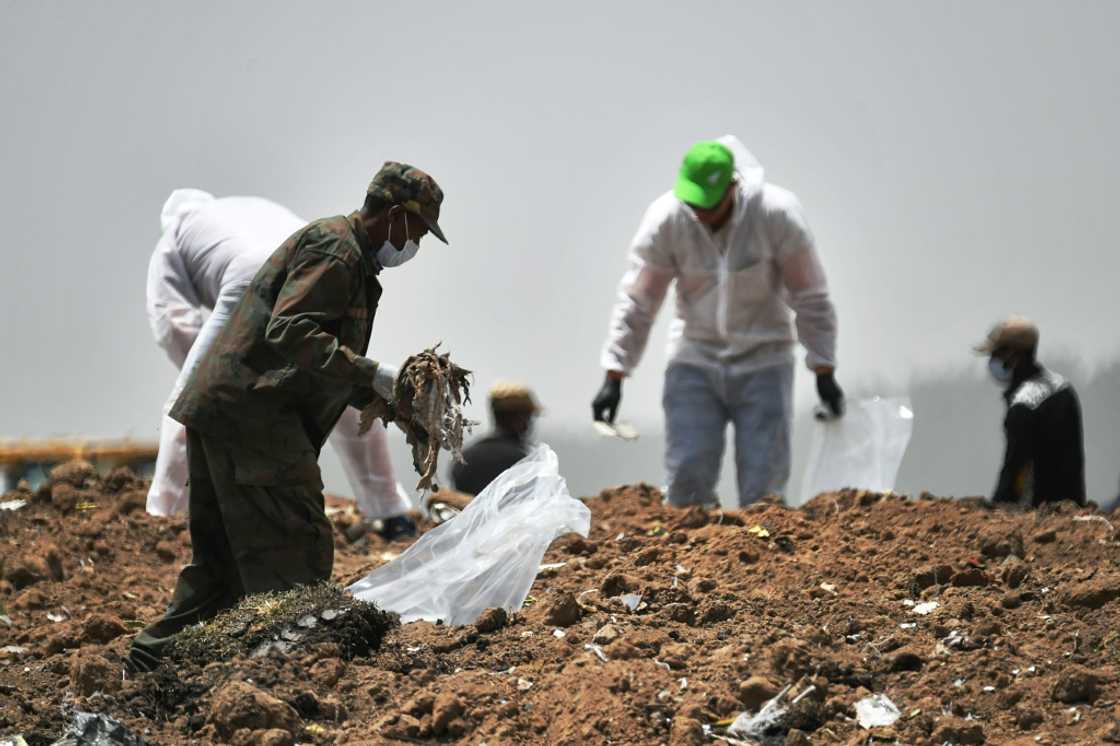 Forensics experts shown in March 2019 combing through the crash site of an Ethiopian Airlines operated Boeing 737 MAX aircraft Forensics experts shown in March 2019 combing through the crash site of an Ethiopian Airlines operated Boeing 737 MAX aircraft