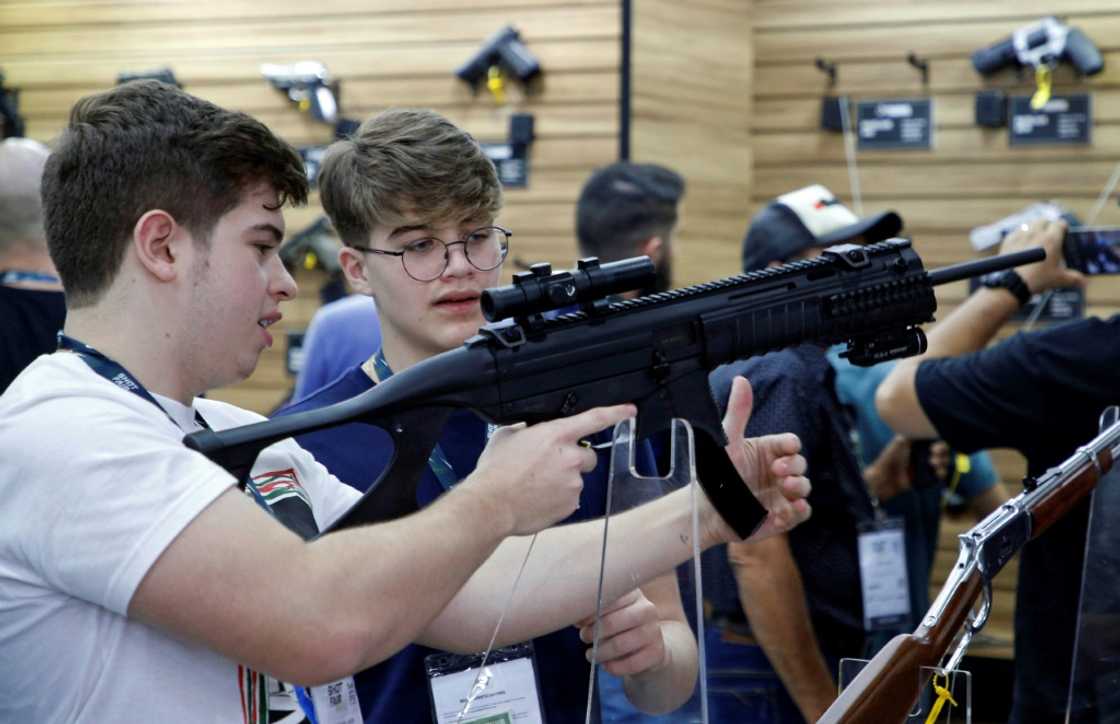 Gun enthusiasts at the Shot Fair Brazil in Joinville, in Santa Catarina state, Brazil, in August 2022 Gun enthusiasts at the Shot Fair Brazil in Joinville, in Santa Catarina state, Brazil, in August 2022