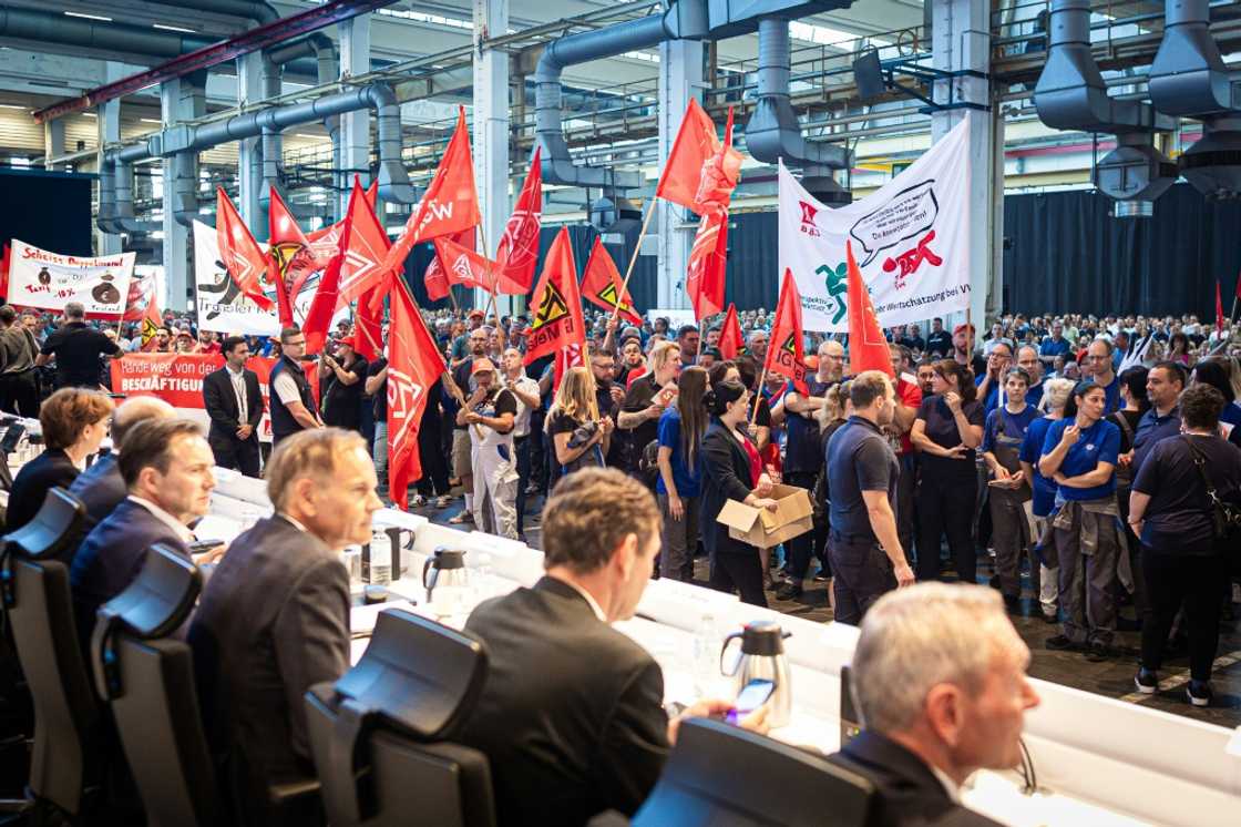 Employees of German car maker Volkswagen (VW) protest at the start of a company's general meeting in Wolfsburg, northern Germany, on September 4, 2024