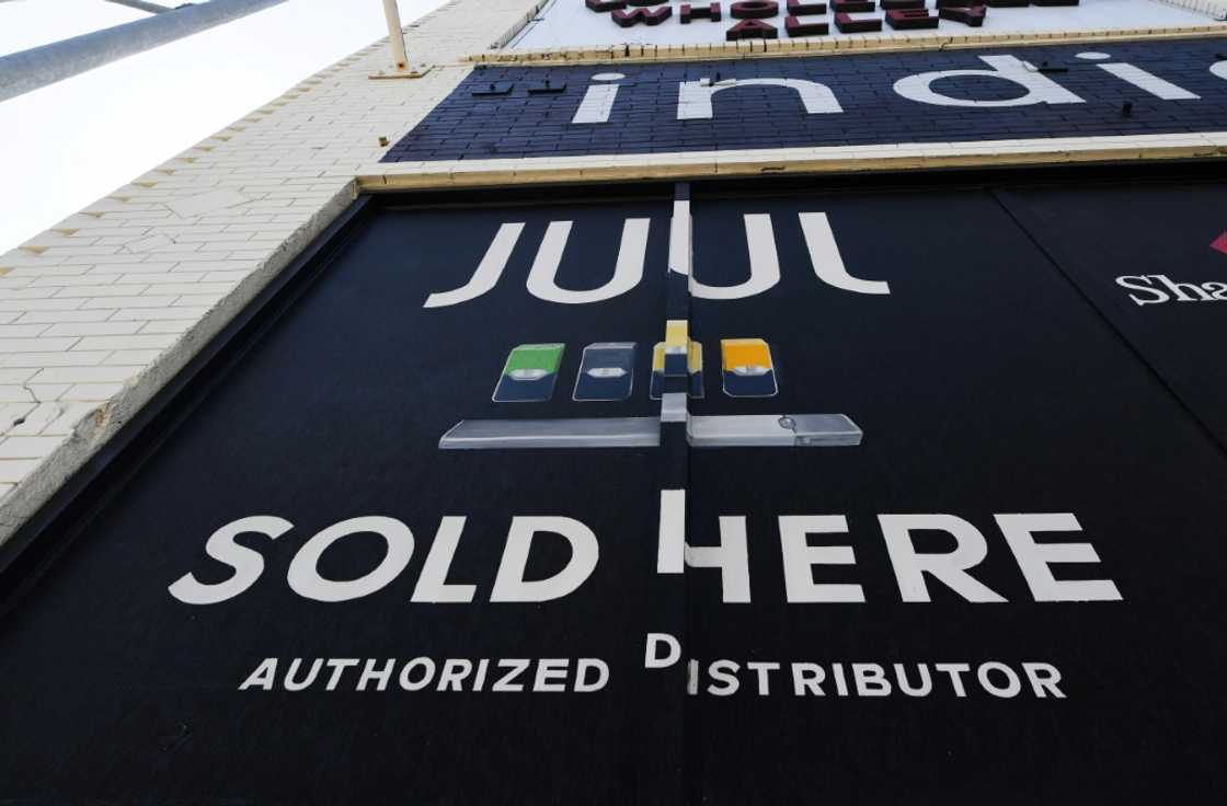 (FILES) In this file photo taken on September 17, 2019 a sign advertises Juul vaping products in Los Angeles, California (FILES) In this file photo taken on September 17, 2019 a sign advertises Juul vaping products in Los Angeles, California