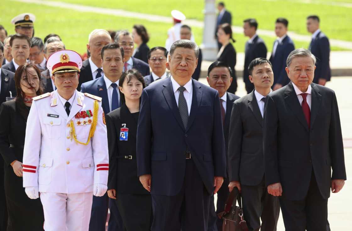 Chinese President Xi Jinping (C) walks with Vietnam's Communist Party General Secretary To Lam (R) at the Ho Chi Minh Mausoleum in Hanoi Chinese President Xi Jinping (C) walks with Vietnam's Communist Party General Secretary To Lam (R) at the Ho Chi Minh Mausoleum in Hanoi