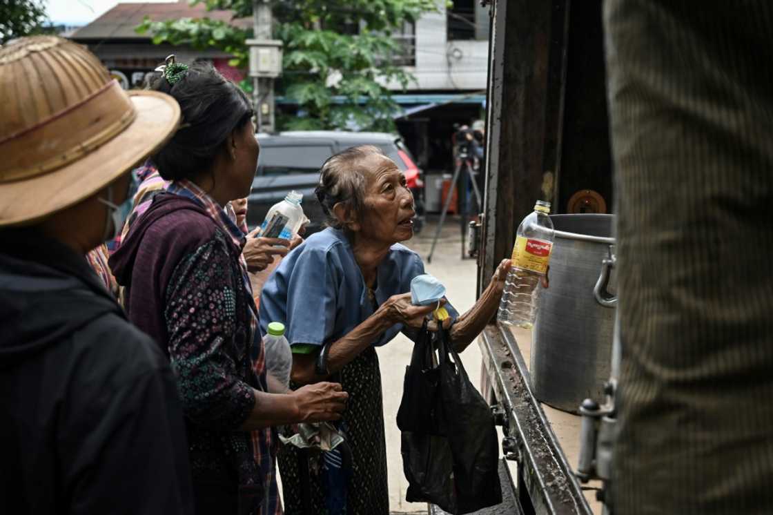 Yangon residents queue to buy cheap vegetable oil as prices spike in Myanmar Yangon residents queue to buy cheap vegetable oil as prices spike in Myanmar