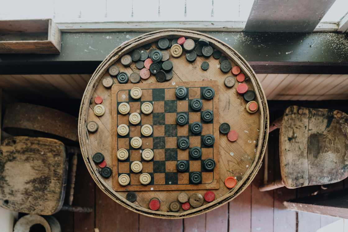 A wooden checkers board