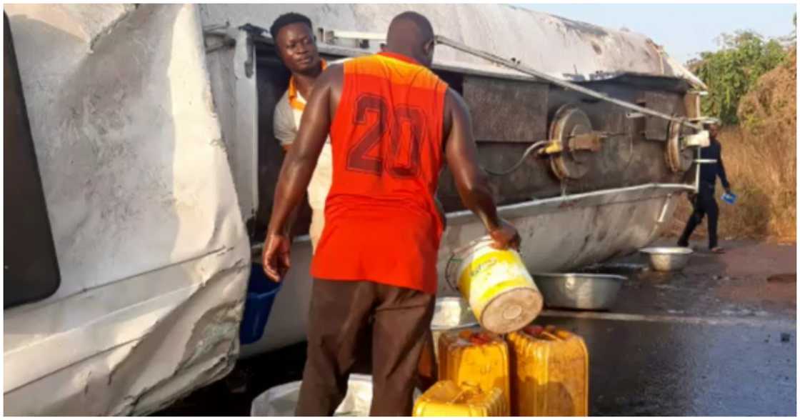 Bimbila residents rush to collect petrol after a fuel tanker tips over