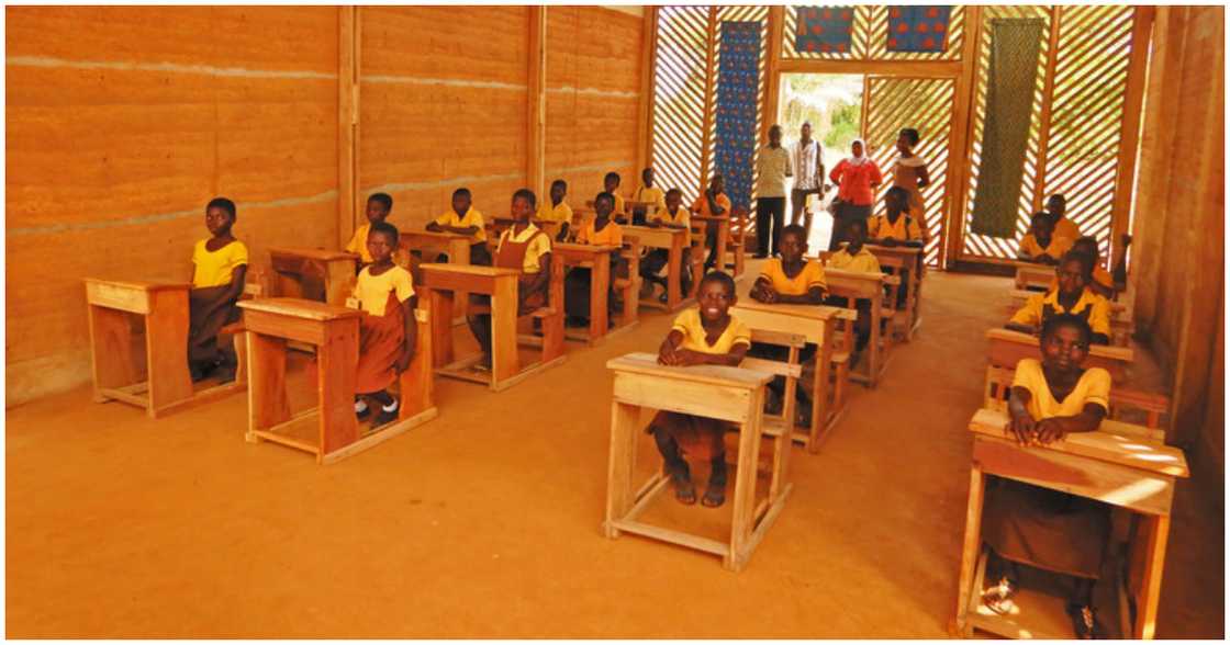 The children of Okorase have a feel of their new classroom block The children of Okorase have a feel of their new classroom block