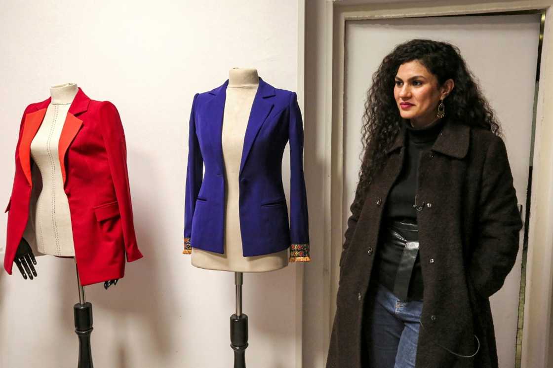 Alaa Adel, an Iraqi fashion designer, poses for a picture at her "Iraqcouture" studio in the capital Baghdad Alaa Adel, an Iraqi fashion designer, poses for a picture at her "Iraqcouture" studio in the capital Baghdad