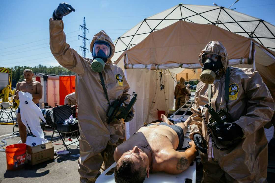 Rescuers take part in an exercise simulating a nuclear incident at the Zaporizhzhia plant on Wednesday Rescuers take part in an exercise simulating a nuclear incident at the Zaporizhzhia plant on Wednesday