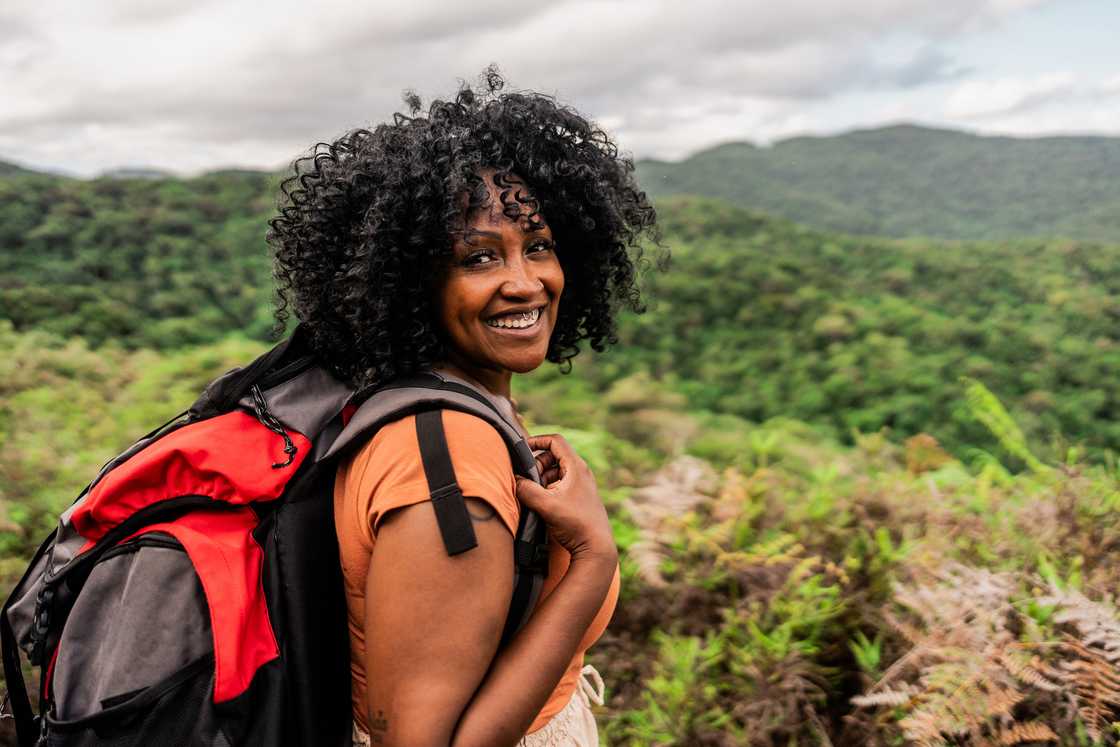 A lady is on a hike A lady is on a hike
