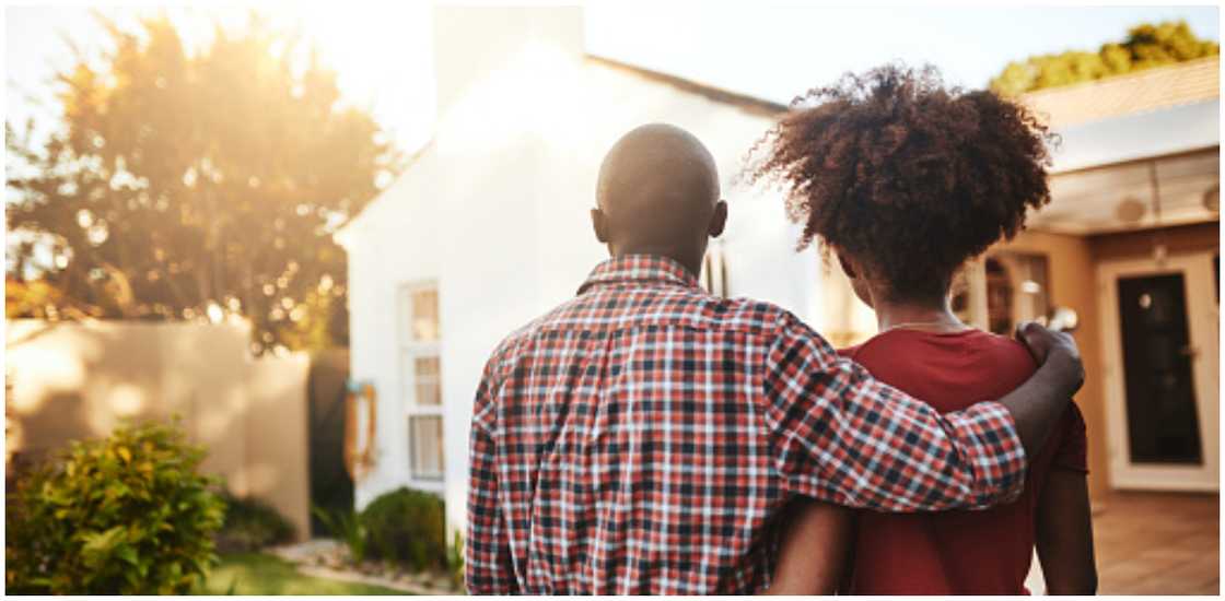 Couple looking at a house