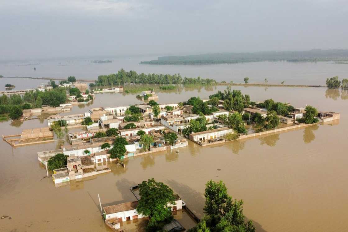 Three rivers in Chrasadda had burst their banks, flooding the town Three rivers in Chrasadda had burst their banks, flooding the town