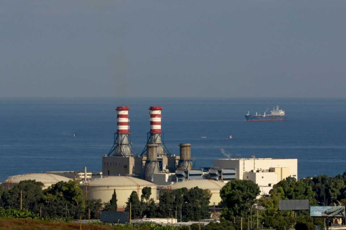 A tanker carrying fuel oil from Iraq is anchored off the Zahrani power plant near the southern Lebanese city of Sidon (Saida) on September 18, 2021 A tanker carrying fuel oil from Iraq is anchored off the Zahrani power plant near the southern Lebanese city of Sidon (Saida) on September 18, 2021