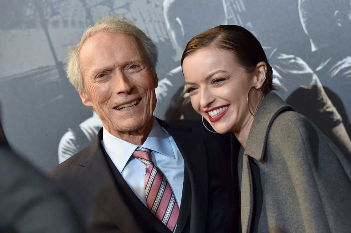Clint Eastwood and daughter Francesca Eastwood at Warner Bros. Studios smiling for a photo Clint Eastwood and daughter Francesca Eastwood at Warner Bros. Studios smiling for a photo