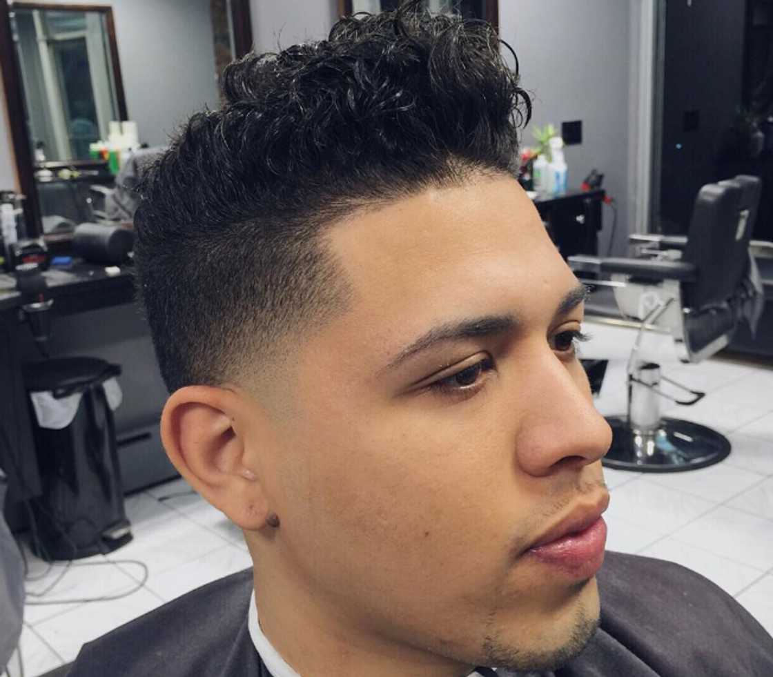 Curly pomp with temple fade Curly pomp with temple fade