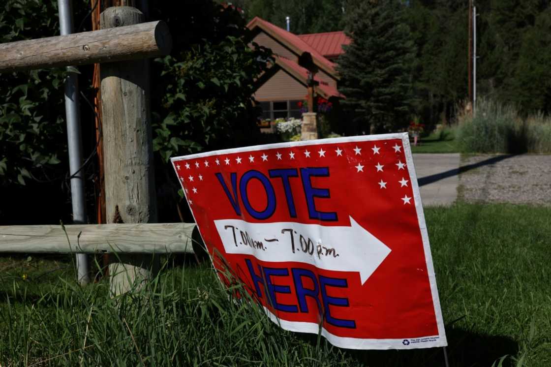 A sign directs voters to a polling place at the Old Wilson Schoolhouse August 16, 2022 in Wilson, Wyoming ahead of primary elections leading up to the Novermber 8 midterm elections