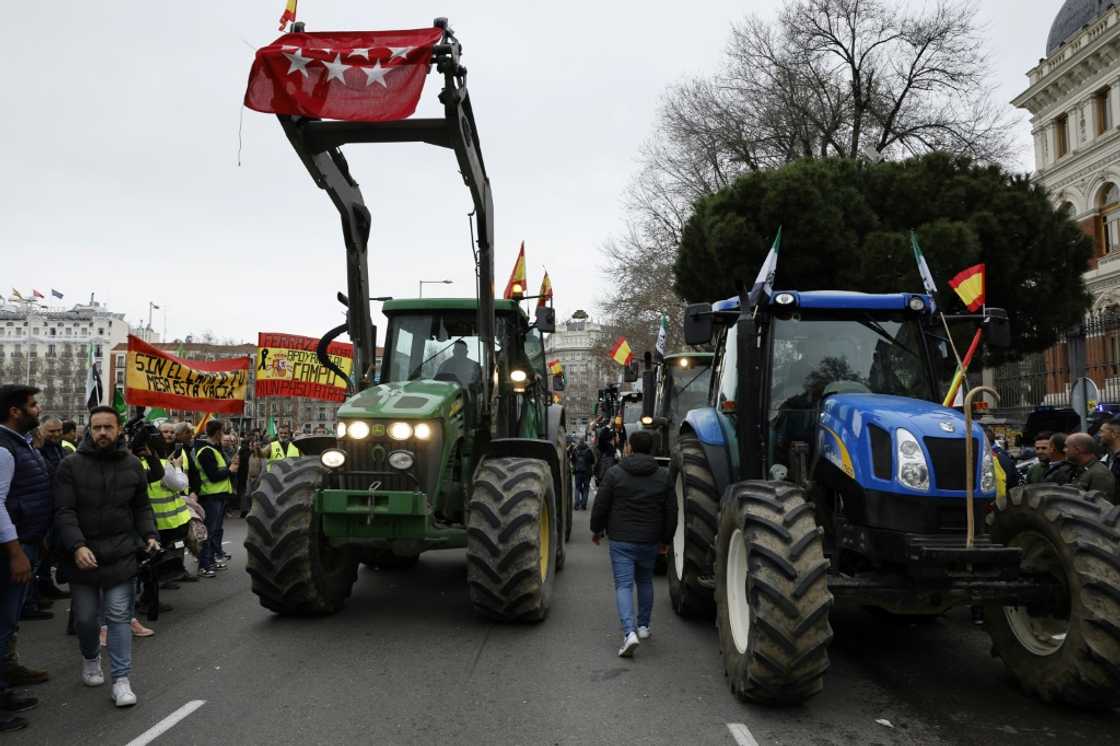 Tractors block off a street in front of Spain's agriculture ministry in central Madrid during a farmers protest on their conditions and European agricultural policy Tractors block off a street in front of Spain's agriculture ministry in central Madrid during a farmers protest on their conditions and European agricultural policy