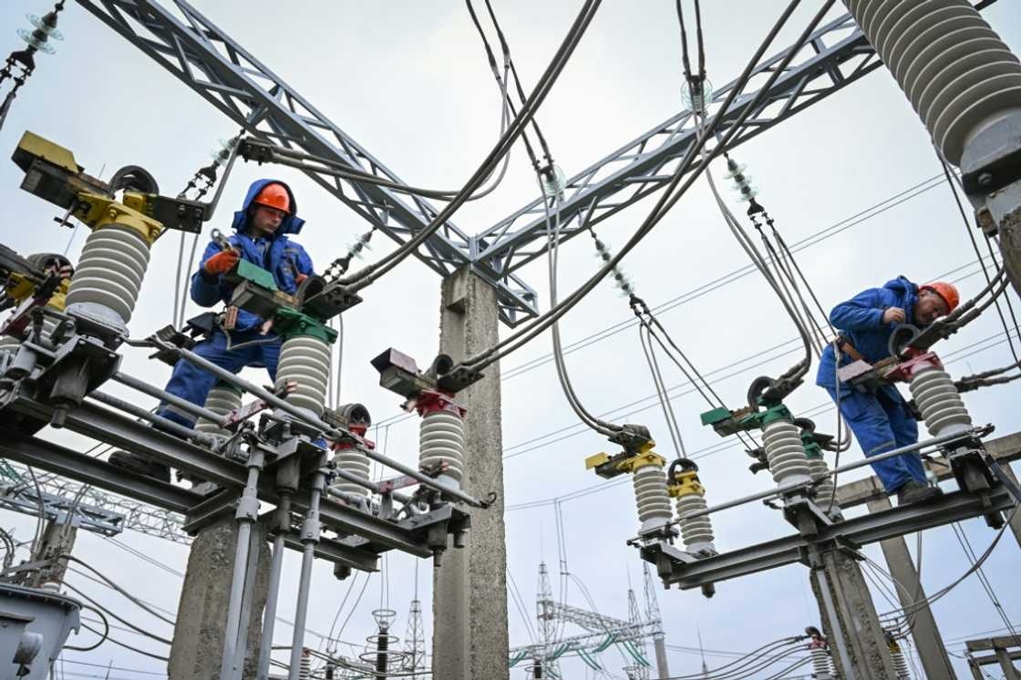 Keeping the lights on: electricians work on power lines near Balti, Moldova Keeping the lights on: electricians work on power lines near Balti, Moldova