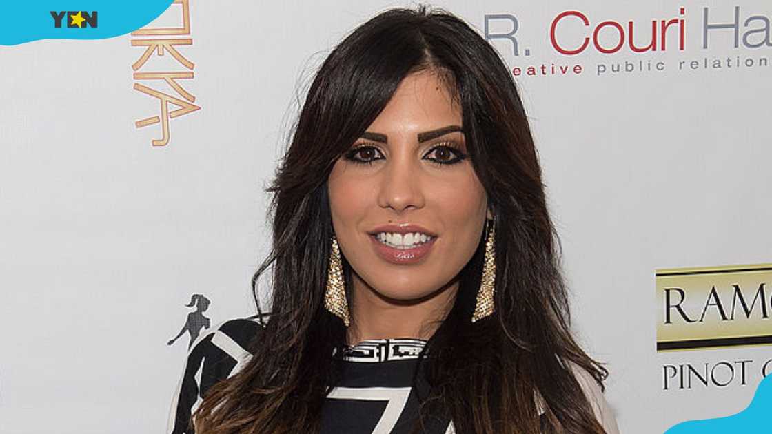 Natalie Guercio in a black and white dress