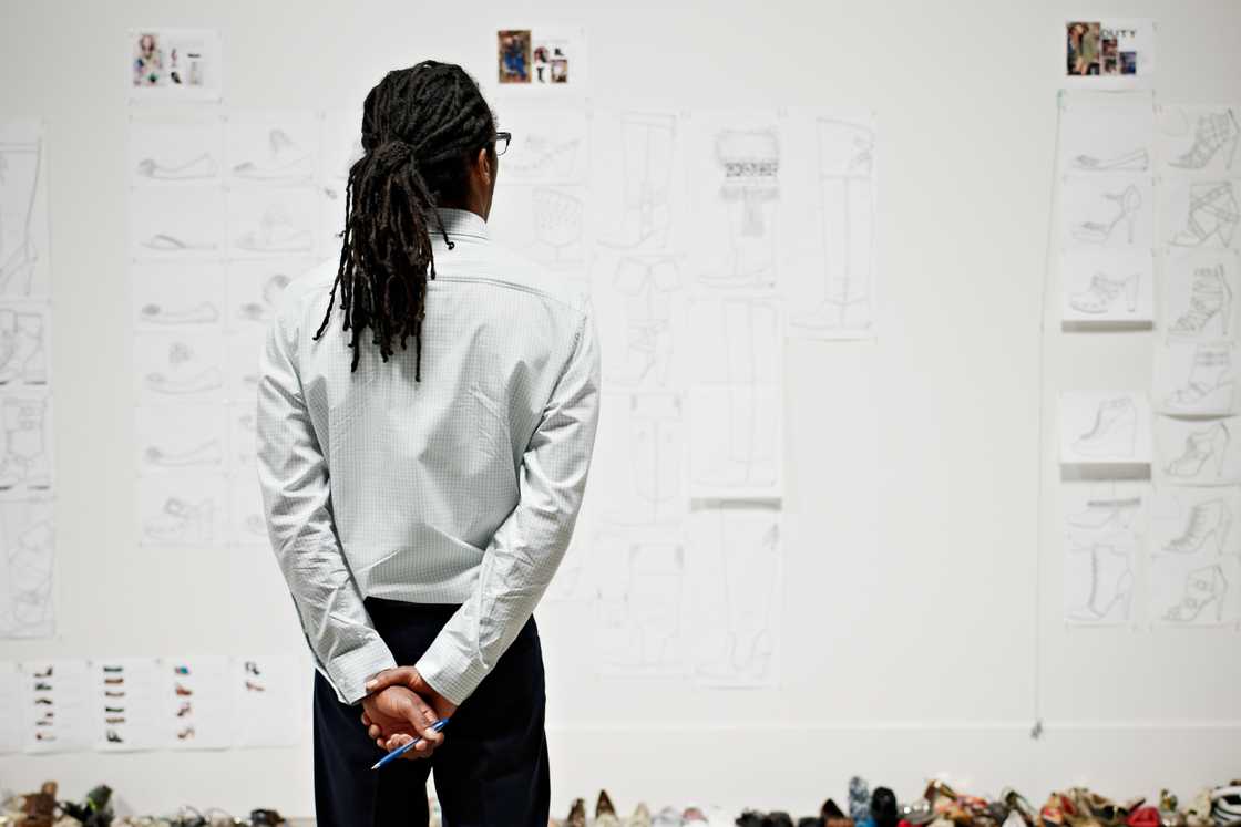 A man is looking at the wall A man is looking at the wall