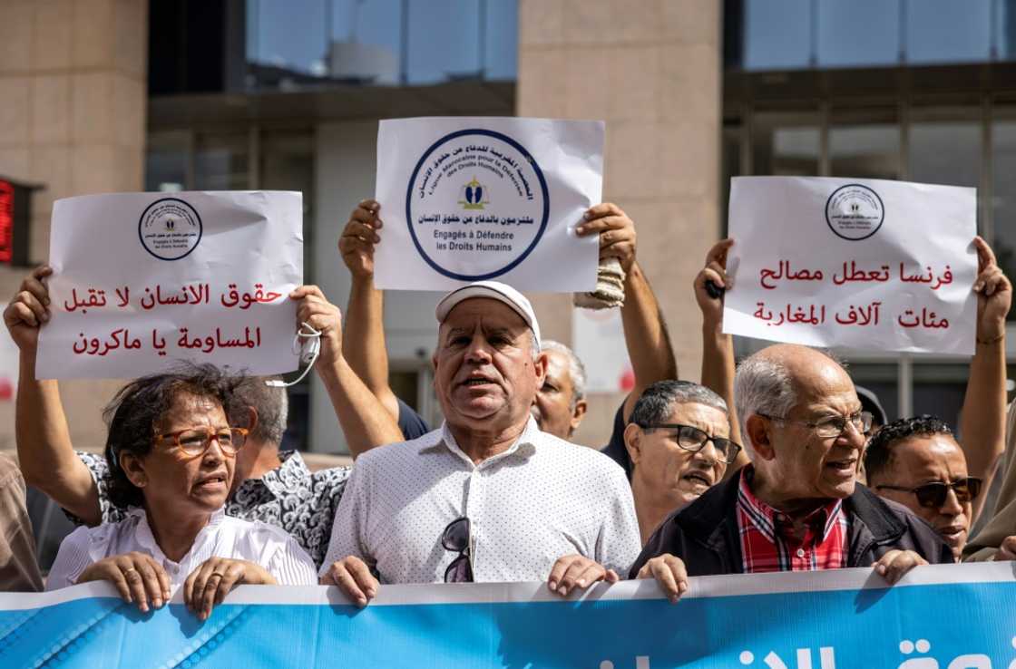 Members of a Moroccan human rights association demonstrate in front of the European Union offices in Rabat against the restriction of visa