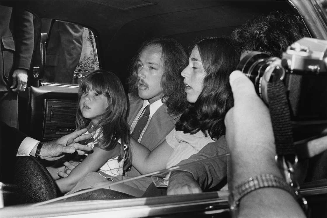 A young Owen Elliot and her aunt, Leah Kunkel, with her husband Russ, attend the funeral for singer Cass Elliot at Groman Mortuary in Los Angeles