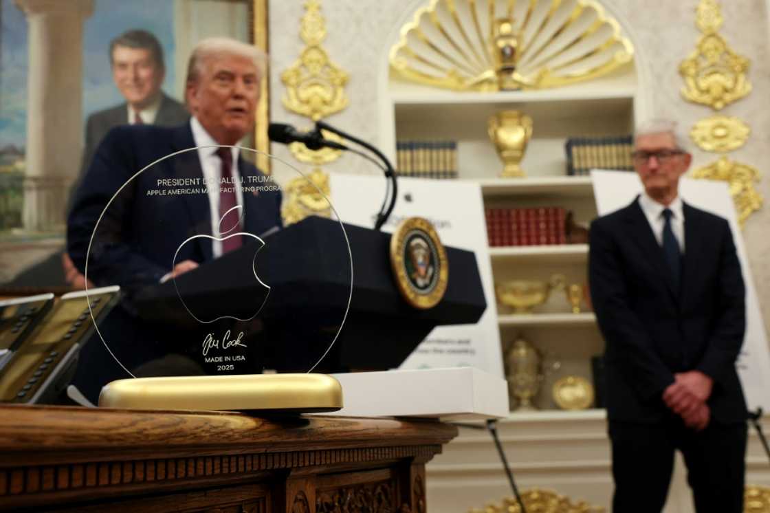 In August, Apple CEO Tim Cook presented President Donald Trump with an engraved glass disc; the company is reportedly considering an investment in Intel, in which the US government holds an equity stake In August, Apple CEO Tim Cook presented President Donald Trump with an engraved glass disc; the company is reportedly considering an investment in Intel, in which the US government holds an equity stake