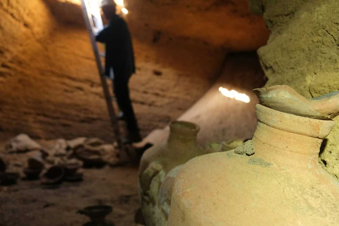 The cave was uncovered on a beach when a mechanical digger  hit its roof, with archaeologists using a ladder to descend into the spacious, man-made square cave