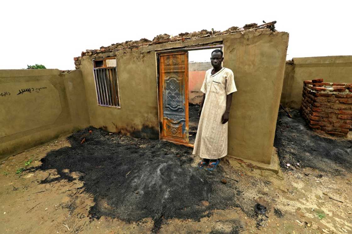 Sudan's Blue Nile state has seen repeated deadly unrest since July: this August 8 photograph shows home that was set on fire near Roseires