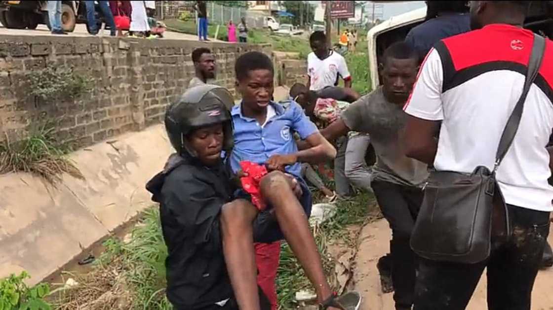 The student pictured here being carried away from the scene of the accident by a passer-by. The student pictured here being carried away from the scene of the accident by a passer-by.